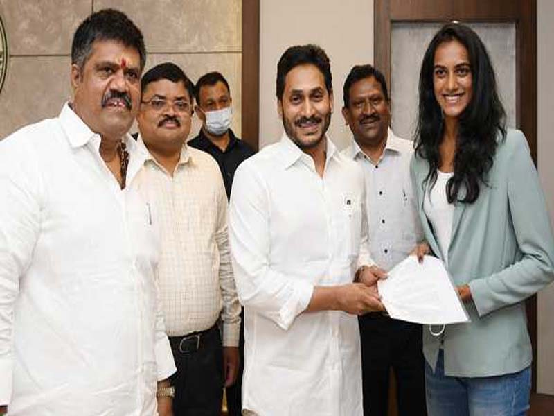AP CM hands over land allocation documents to P V Sindhu