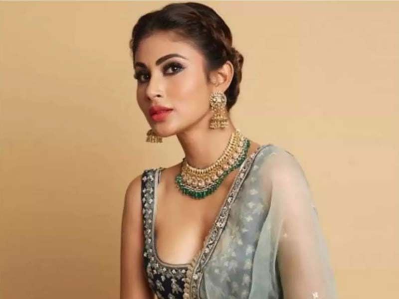 Mouni Roy looks vibrant in Sun-Mooning pics with hubby in tow