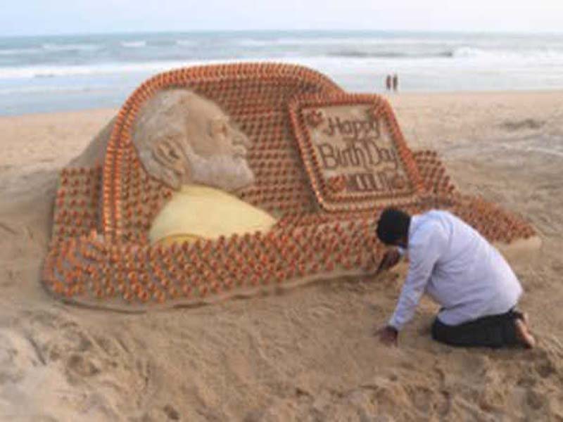 Sudarsan Pattnaik creates PM Modi’s sand sculpture with 1213 mud tea cups