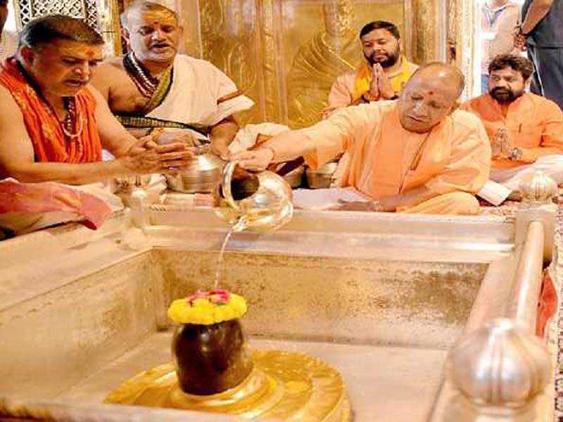 At the Kashi Vishwanath and Kaal Bhairav temples, a yogi offers prayers.