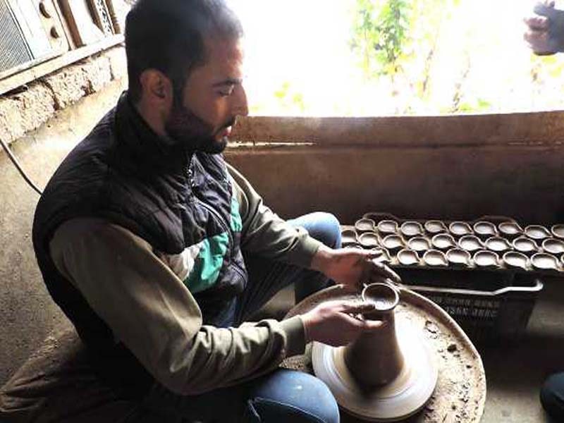Ahead of Diwali, Kashmiri potters are hard at work creating earthen lamps.