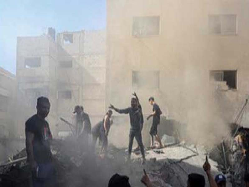 Israeli planes strike a structure in the Gaza Strip next to the Al-Quds Hospital.
