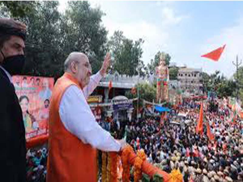 Amit Shah drives a spirited roadshow through Hyderabad.