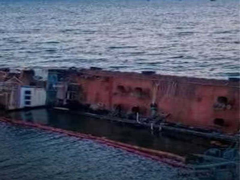 Six members of the sunken oil tanker crew are still missing; one Indian has been confirmed dead.