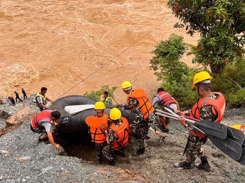 An Indian rescue team locates possible bus wreckage sites in Nepal.