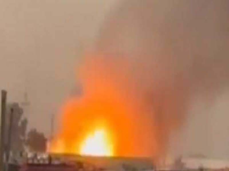 Explosions rock the ammunition storage for Iraqi paramilitary forces.