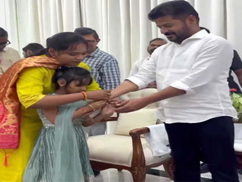 Children present Telangana CM with Rakhi.